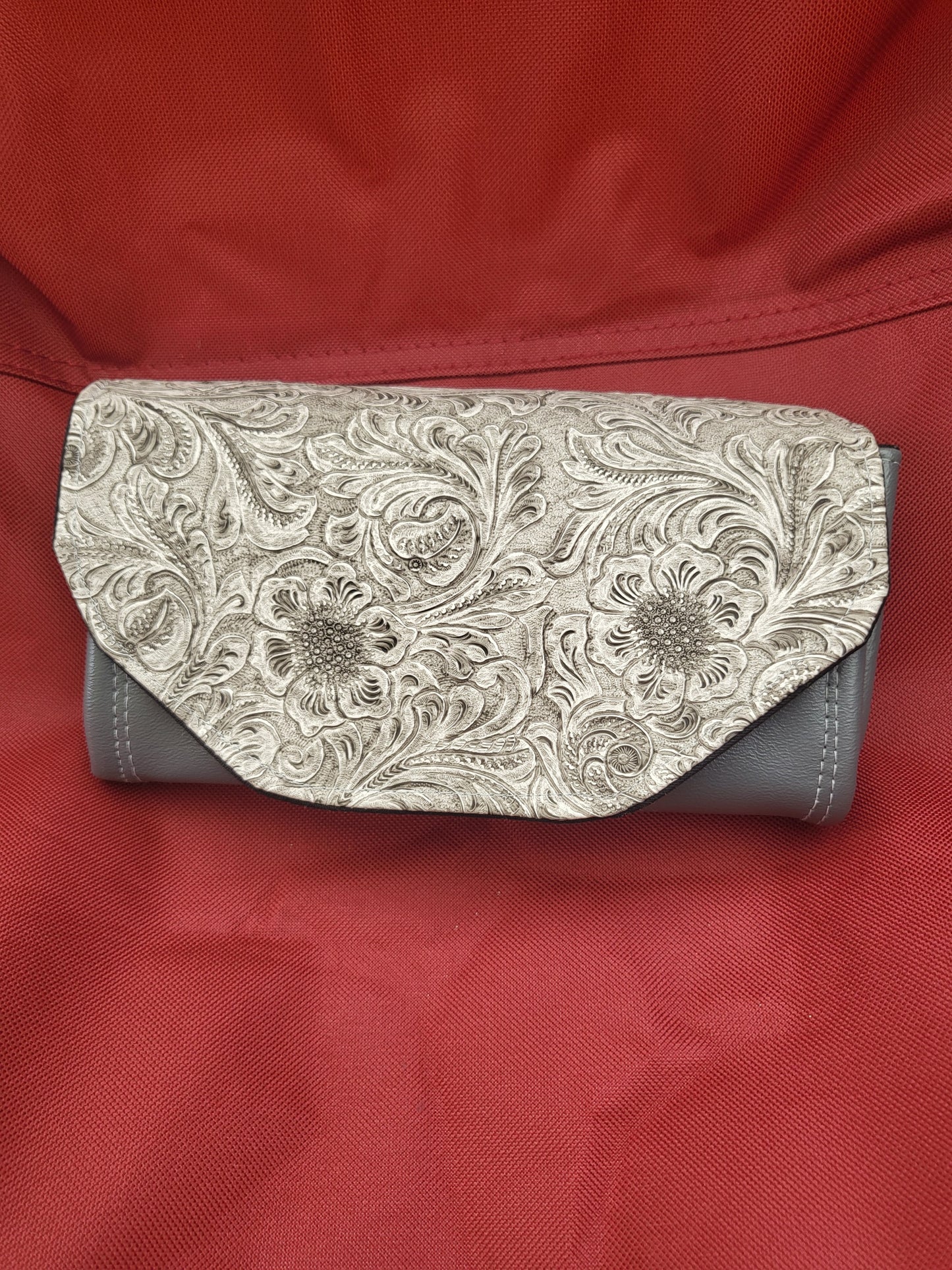 Handmade clutch wallets made with upcycled fabrics - embossed