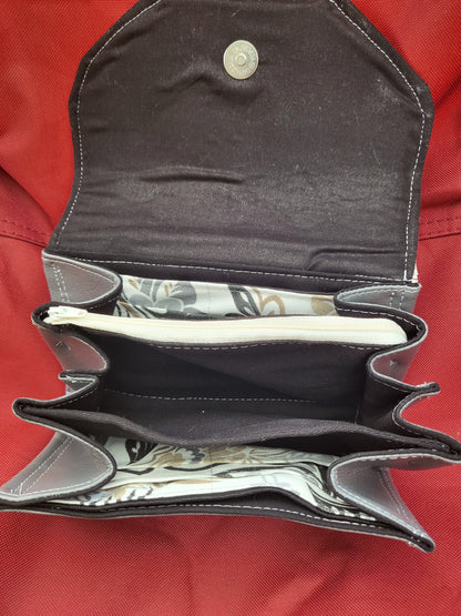 Handmade clutch wallets made with upcycled fabrics - embossed