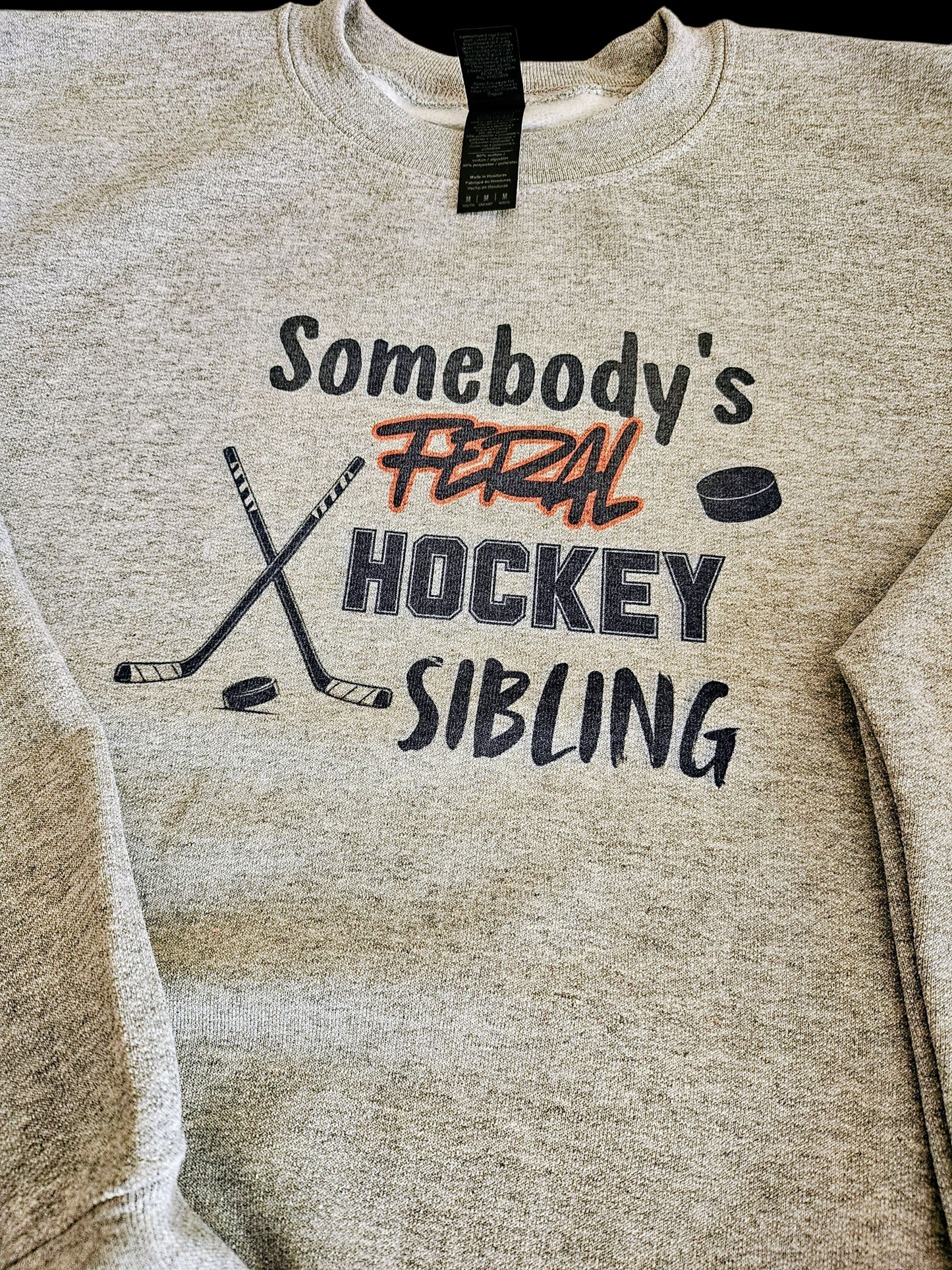 Someone's feral hockey sibling crewneck