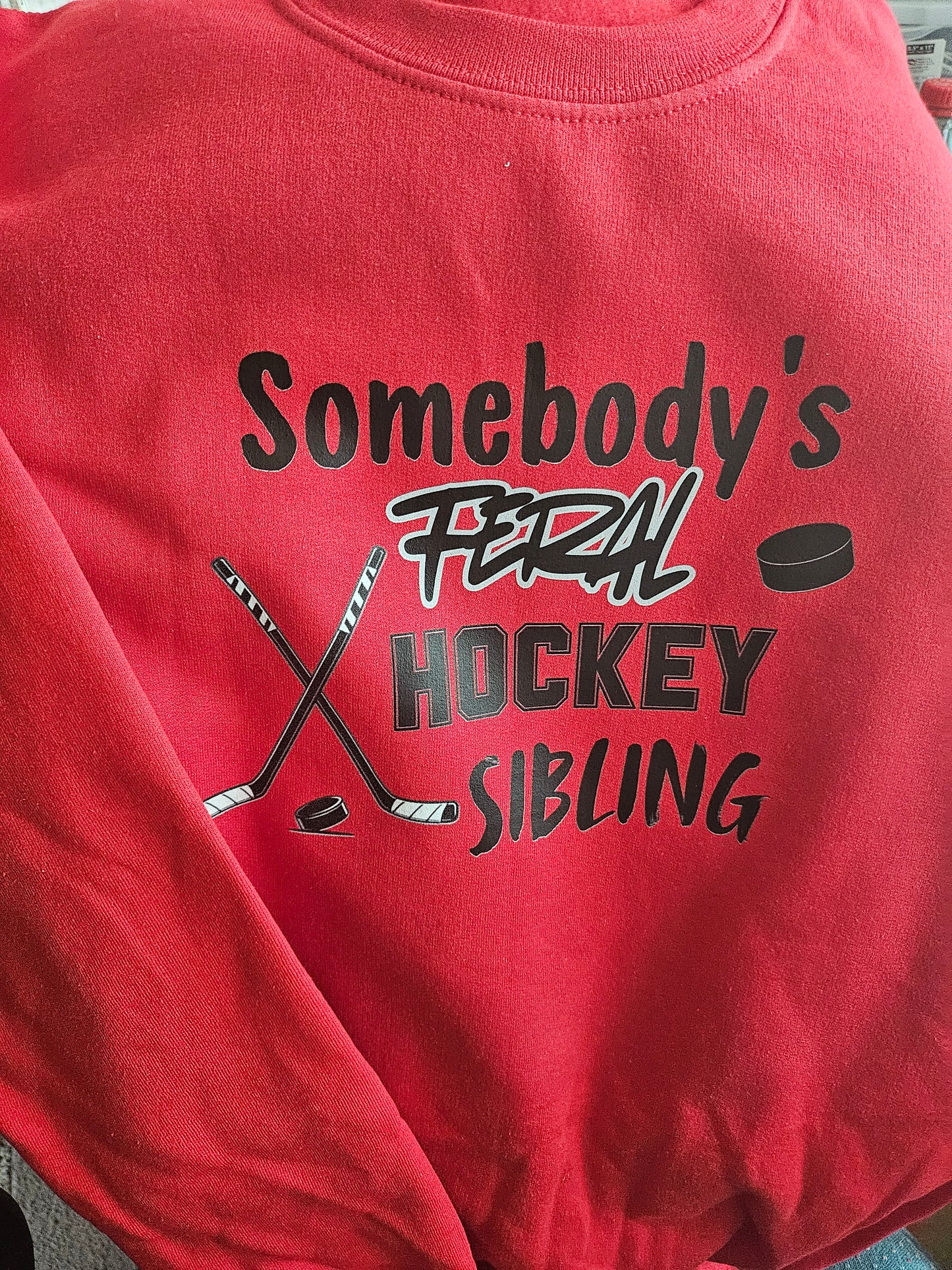 Someone's feral hockey sibling crewneck